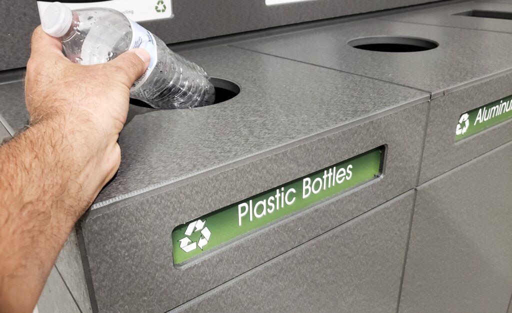 Eco-friendly trash containers on Earth day specified plastic bottles in disposal of wastes.